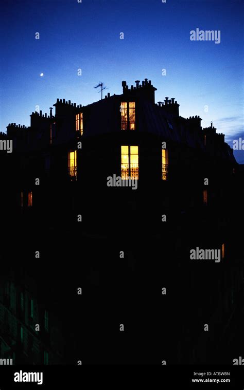 Apartment building at night, silhouette Stock Photo - Alamy