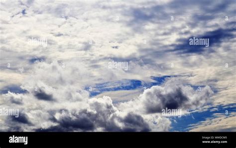 Stunning Mixed Cloud Formation Panorama On A Deep Blue Summer Sky Stock