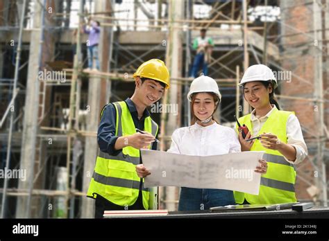 Specialists And Team Of Civil Engineer Working Checking Plan Together