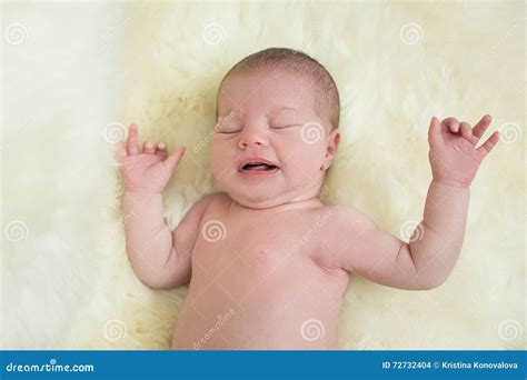 Baby Girl Crying On A Light Bedspread Stock Photo Image Of Infant