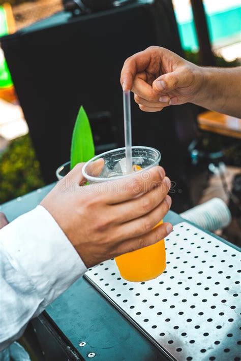 The Bartender Prepares A Cocktail With Passion Fruit Stock Photo