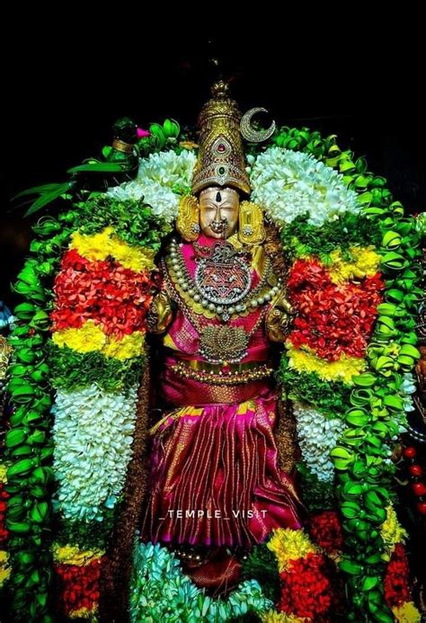 The Idol Is Decorated With Flowers And Leaves