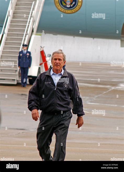 President George W Bush Exits Air Force One To Speak To Military