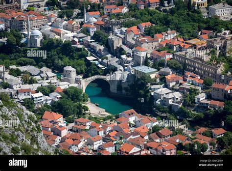 An Aerial View Of The Neretva River Which Runs Across Old Mostar And