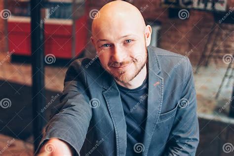 Smiling Attractive Adult Successful Bald Bearded Man In Suit With