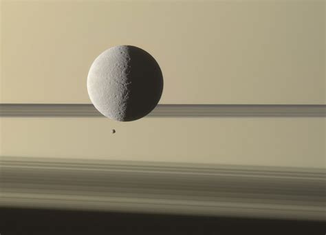 Saturn Dwarfs Tiny Moon Epimetheus and Larger Rhea - SpaceRef