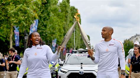 France S Thierry Henry And Romane Dicko Carry Olympic Flame Through