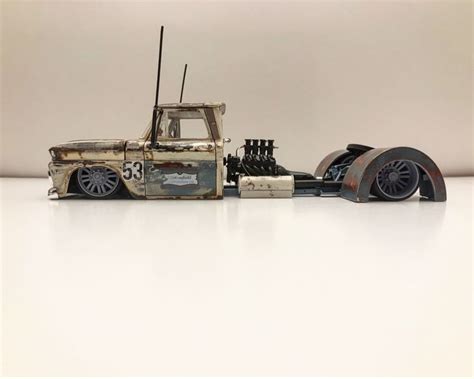 An Old Toy Truck Is Sitting On The Floor In Front Of A White Wall