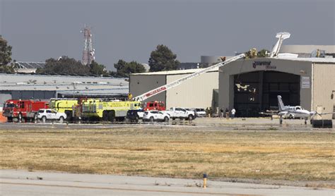 Small Plane Crashes Into Roof Of Hangar At Long Beach Airport Long