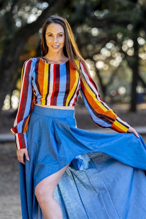 A Lovely Brunette Model Poses Nude At The Coast With An American Flag