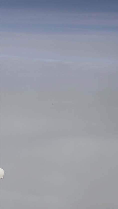 White orb spotted from plane : r/UFOs