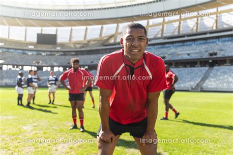 Portrait Of Tired African American Male Rugby Player Standing With