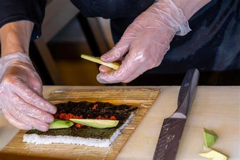 Premium Photo | Chef preparing sushi in a restaurant