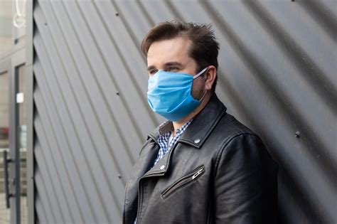 Premium Photo Man Wearing Mask Standing