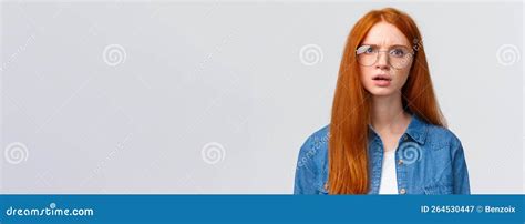 Confused And Displeased Unsure Redhead Girl In Glasses Having Conversation Talking Look