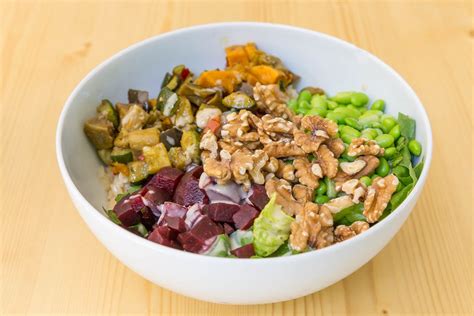 Quinoa Salad With Cucmber Tomato And Edamame In A White Bowl