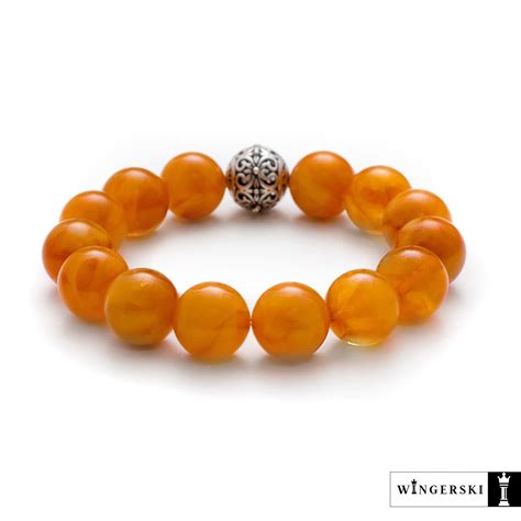 Женский браслет из балтийского янтаря с серебряным шармом купить в ...