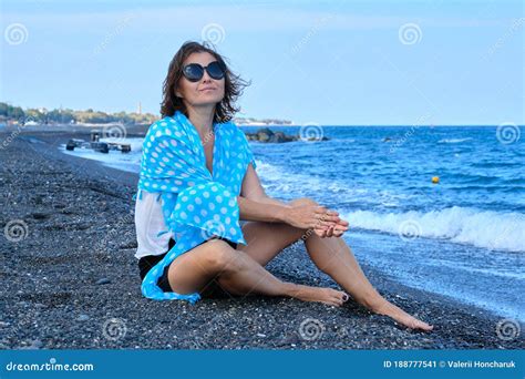 Middle Aged Woman Sitting On Sea Beach Traveling Happy Resting Female