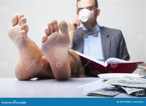 Successful Happy Young Businessman With Bare Feet Works In Office