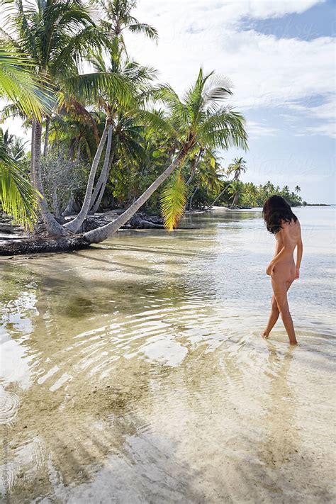 Nude Woman Standing In Ocean Lagoon By Stocksy Contributor Trinette