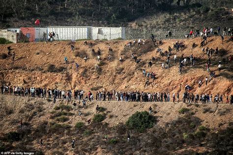 Migrants Storm EU Border Hundreds Swarm Barbed Wire Fence After