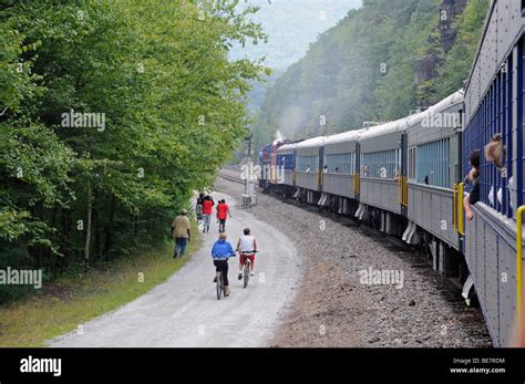 People From Moving Train Watching On Biking Tourist Lehigh Gorge