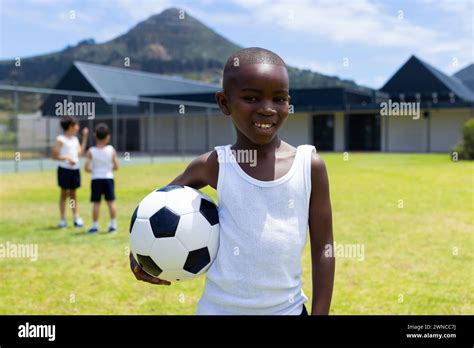 Black african boy playing soccer hi-res stock photography and images ...