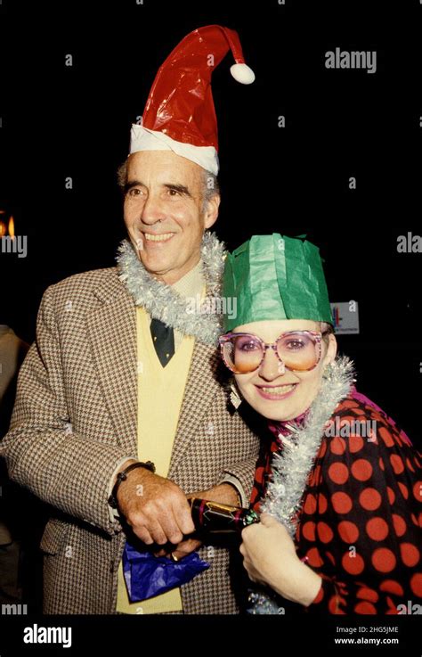 Actor Christopher Lee And Actress Su Pollard Pulling A Christmas