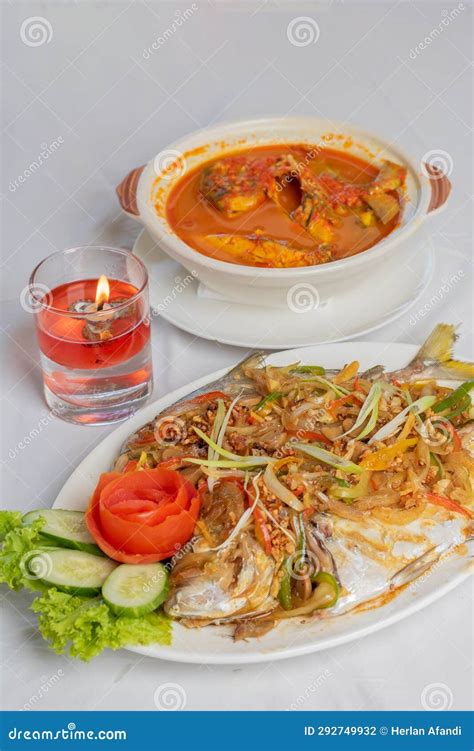 Steamed Pompano Or Kuwe Fish With Sweet And Spicy Sauce Stock Photo