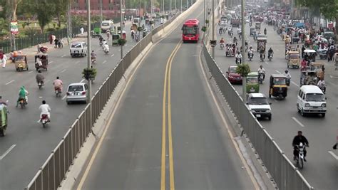 LAHORE, PAKISTAN - NOVEMBER 30: Lahore Metro Bus Leaving Passenger Platform. Lahore Metro Has A ...