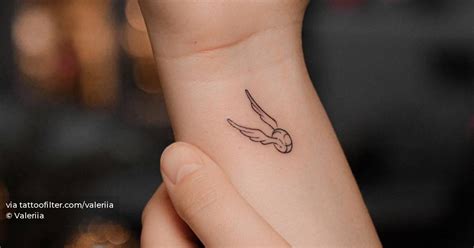 Minimalistic Golden Snitch Tattoo Done On The Wrist