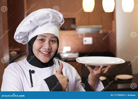 Asian Female Chef Shows Empty White Plate Presenting Something Copy