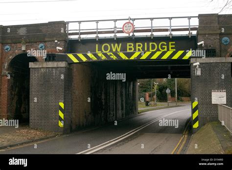 low bridge bridges sign signs road rail height restriction uk Stock Photo - Alamy