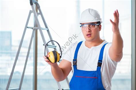 Young Worker With Noise Cancelling Headphones Picture And HD Photos ...