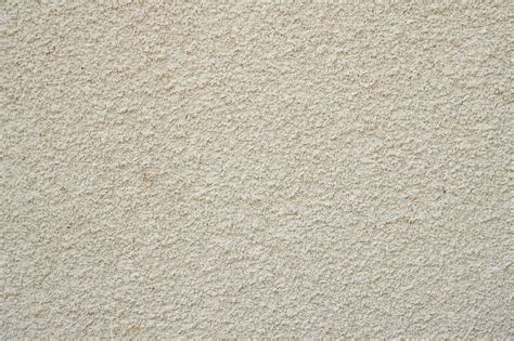 Premium Photo Textured Beige Plaster On The Wall