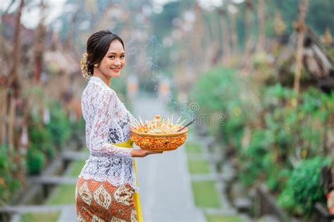 Beauty Of Balinese Woman Smiling To Camera Standing In Bali Village