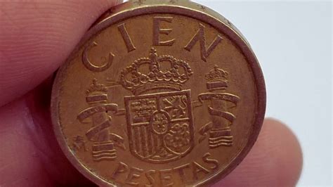 Ayuda económica con pesetas españolas Con esta moneda de 100 pesetas