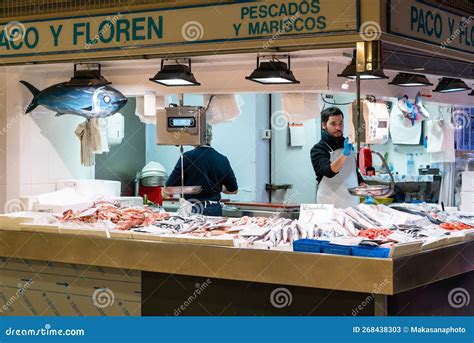 Fishmonger And Market Stall With Fresh Seafood In The Alicante Market