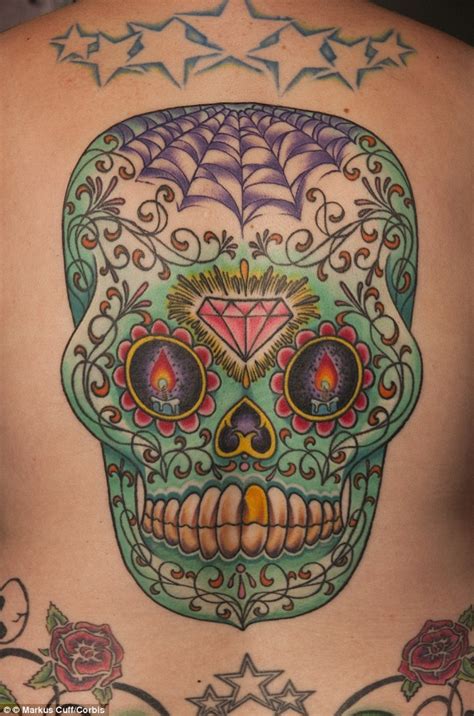 PHOTOS : The hidden meaning of tattoos