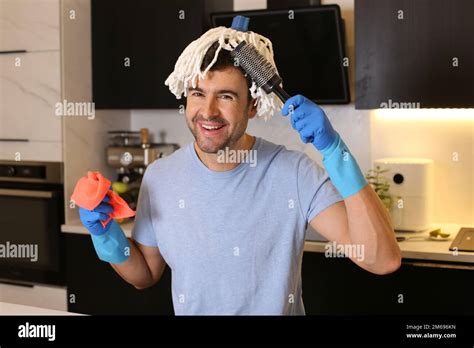 Funny Man Combing His Mop Hair Stock Photo Alamy