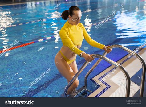 Woman Yellow Bikini Coming Out Swimming Stock Photo