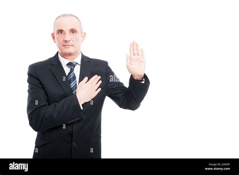 Portrait Of Aged Elegant Man Making Oath Gesture Wearing Suit And Tie