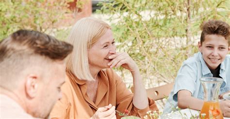 A Happy Family Eating Together · Free Stock Photo