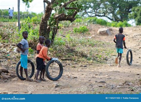 African Little Children Playing With Wheels Editorial Stock Photo