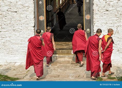 Unidentified Buddhist Monks With Traditional Robes Are Entering The