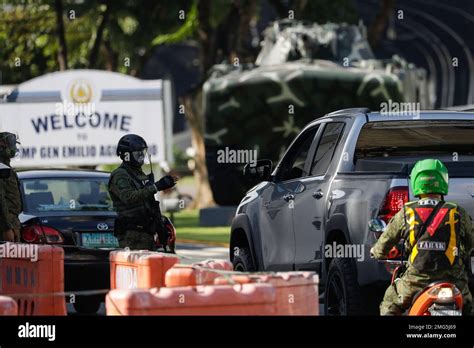 Soldiers Secure The Gates Of Camp Aguinaldo Military Headquarters Where