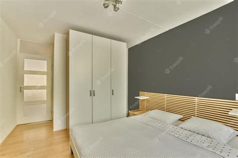 Premium Photo | Stylish bedroom with bed and wardrobe