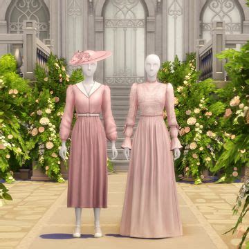 Two Mannequins Dressed In Long Dresses And Hats Stand Next To Each Other