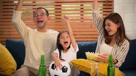 Happy Family Watching Sports Match Together on Television Stock Footage ...