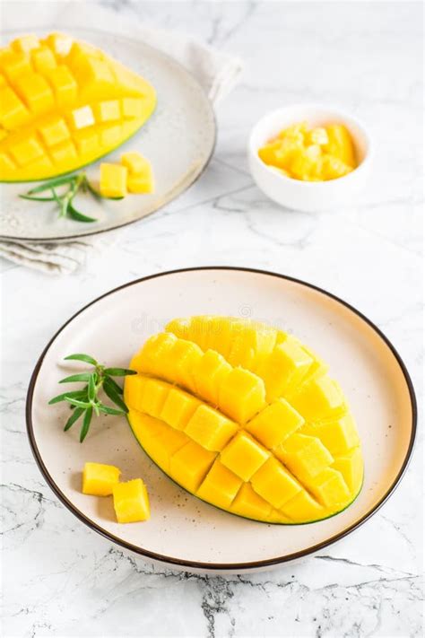 Ripe Sliced Mangoes On Plates On The Table Tropical Fruit Stock Photo